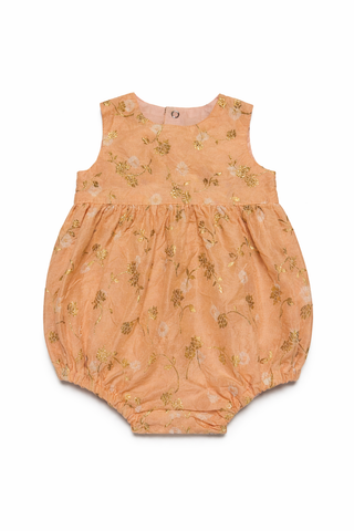 Peach Baby romper with floral pattern on a white background